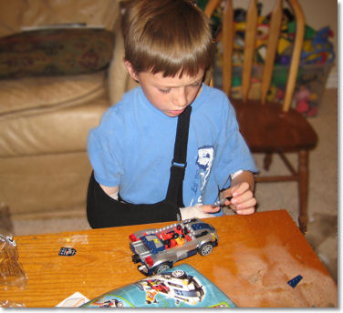 Ethan Learning to Build a Big Lego Set Left-Handed